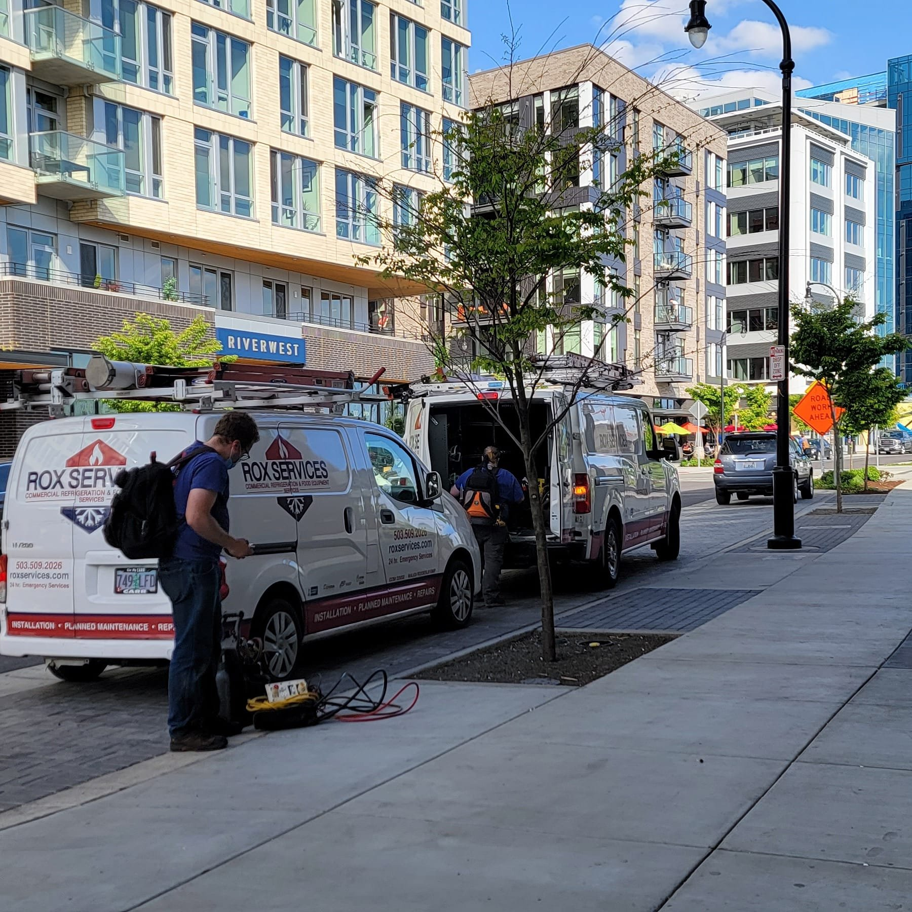Rox Services vans on a Portland job