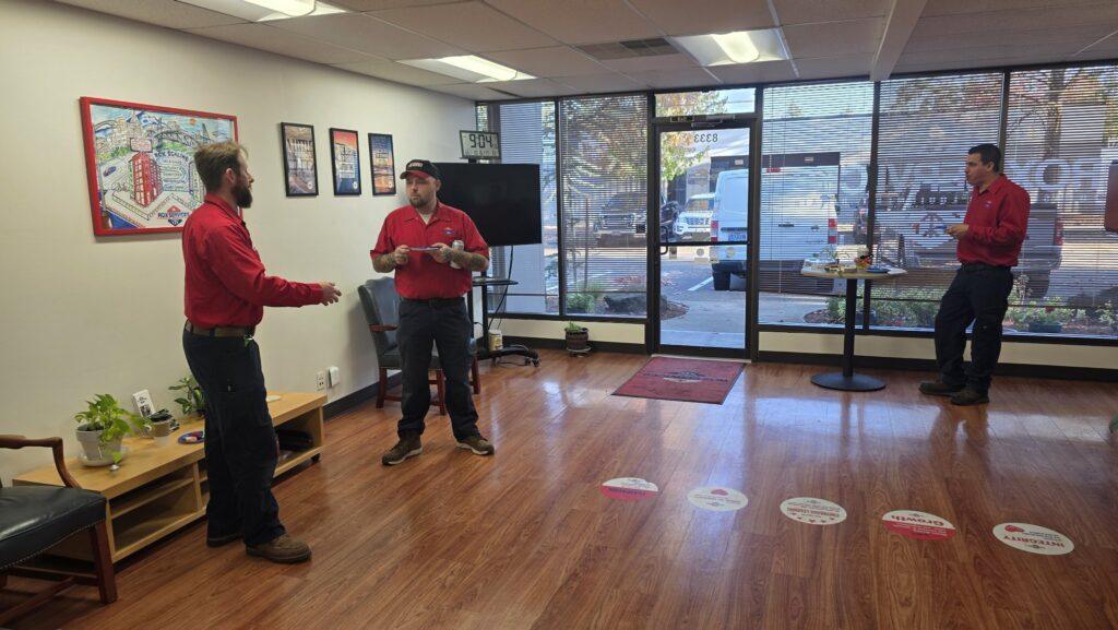 Rox Services technicians in a morning huddle at the Beaverton office